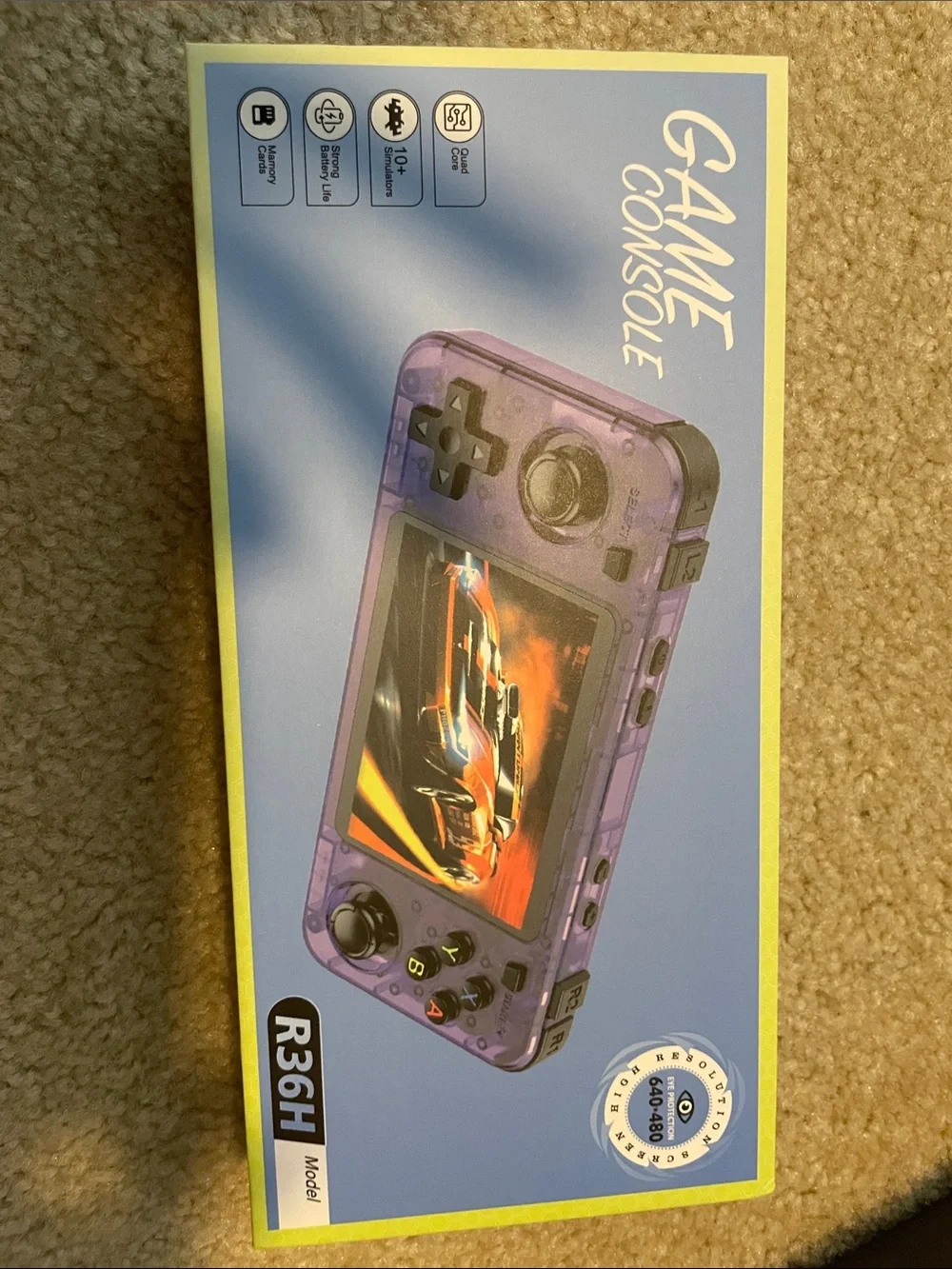 Transparent Blue Handheld Gaming Console with Dual Analog Sticks